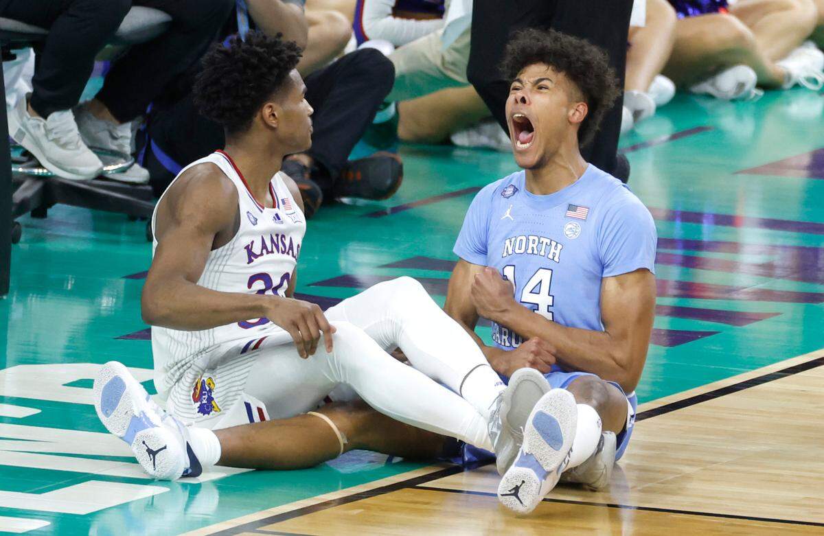 North Carolina’s Puff Johnson (14) celebrates after Kansas’ Ochai Agbaji (30) was called for the charge during the second half of Kansas’ 72-69 victory over UNC in the NCAA Men’s National Championship at the Caesars Superdome in New Orleans, La., Monday, April 4, 2022.
