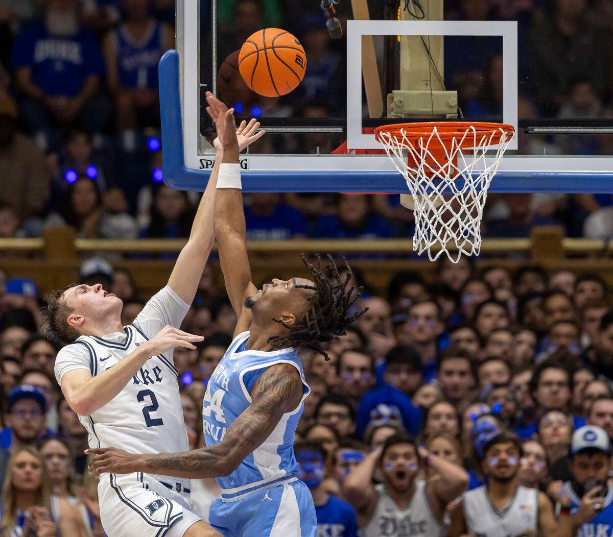 Duke’s Cooper Flagg (2) drives to the basket against North Carolina forward Jae’Lyn Withers (24) in the second half on Saturday, February 1, 2025 at Cameron Indoor Stadium in Durham, N.C.