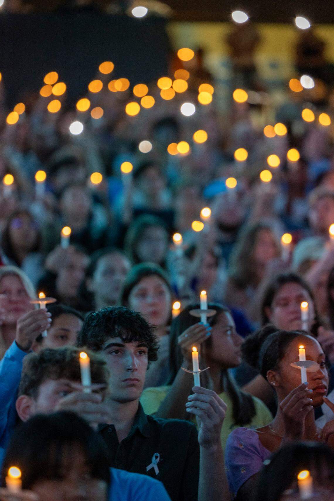 UNC-Chapel Hill students, faculty and family hold a candlelight vigil Friday, Aug 30, 2023 at the Dean Smith Center in honor of professor Zijie Yan who was shot and killed on campus on Monday.