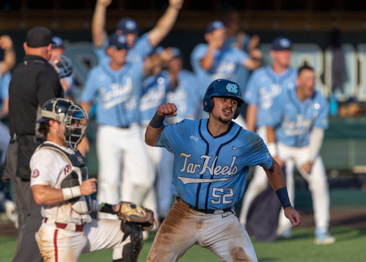North Carolina’s Tomas Frick (52) scores on a single by Patrick Alvarez (8) to give the Tar Heels a 3-2 lead in the ninth inning in game two of their NCAA Super Regional series on Sunday, June 12, 2022 at Boshamer Stadium in Chapel Hill, N.C.
