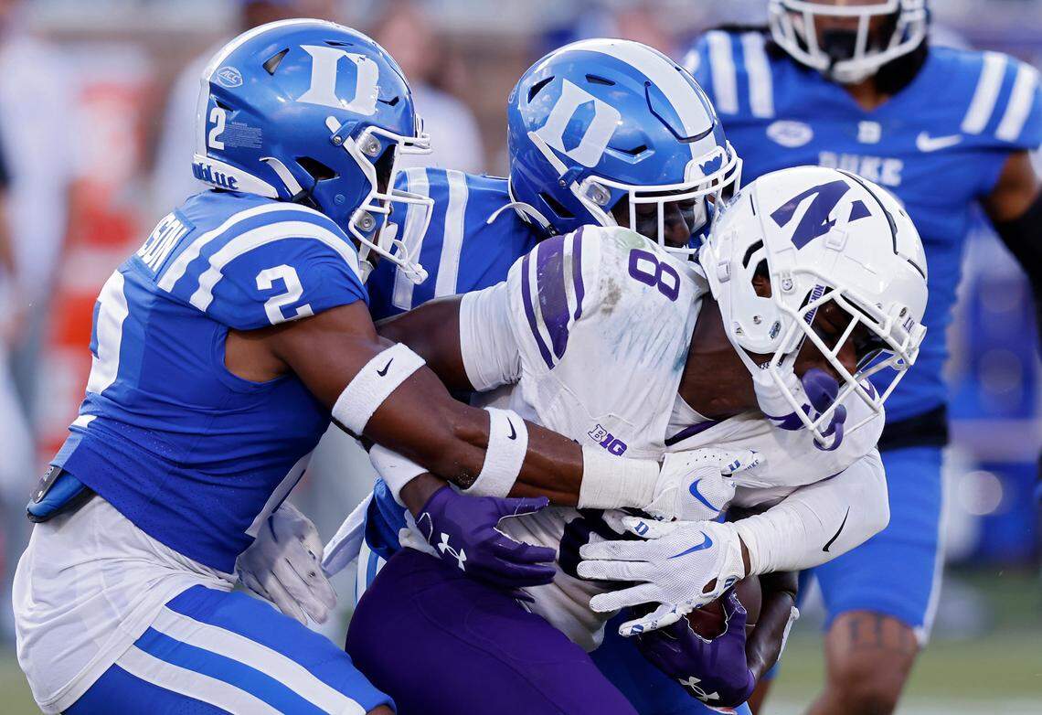 Duke’s Jaylen Stinson and Tre Freeman bring down Northwestern’s A.J. Henning during the second half of the Blue Devils’ 38-13 win on Saturday, Sept. 16, 2023, at Wallace Wade Stadium in Durham, N.C.