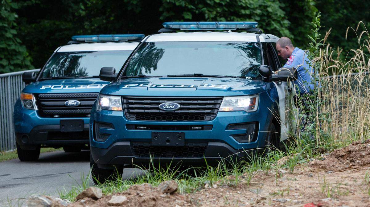 Raleigh police block the entrance of House Creek Greenway Trail near Martin Middle School Tuesday morning, June 12, 2018. At about 6:35 p.m. on Monday, Raleigh police officers discovered human remains in a wooded area near Lake Boone Trail and Interstate 440.