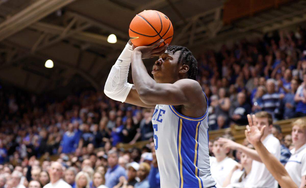 Duke’s Mark Mitchell (25) prepares to drill a three-pointer to put Duke up 66-62 with 12 seconds left in the game during the second half of Duke’s 68-64 victory over Notre Dame at Cameron Indoor Stadium in Durham, N.C., Tuesday, Feb. 14, 2023.