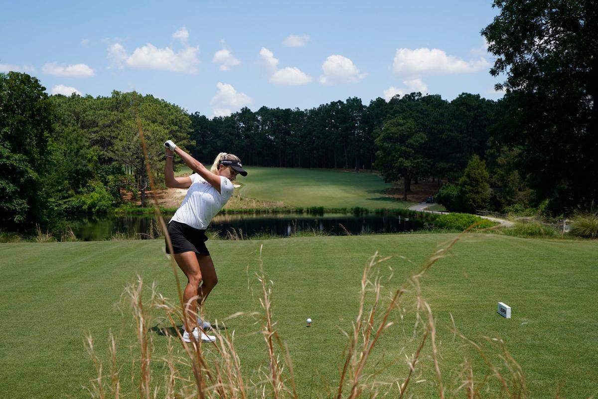 Lexi Thompson hits off the first tee during a practice round for the the U.S. Women’s Open golf tournament at the Pine Needles Lodge & Golf Club in Southern Pines, N.C. on Tuesday, May 31, 2022. (AP Photo/Chris Carlson)
