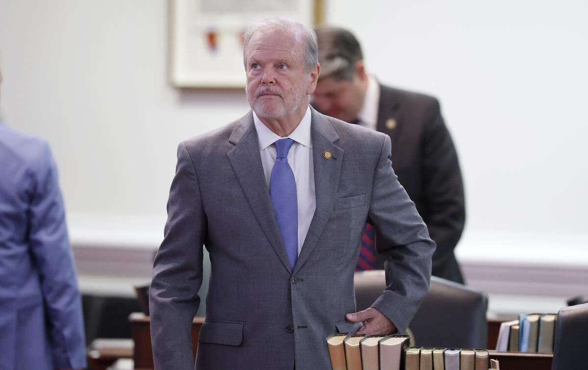 N.C. Sen. leader Phil Berger stands at his desk before the session in the N.C. Senate chamber in the Legislative Building in Raleigh, Tuesday, April 21, 2026.
