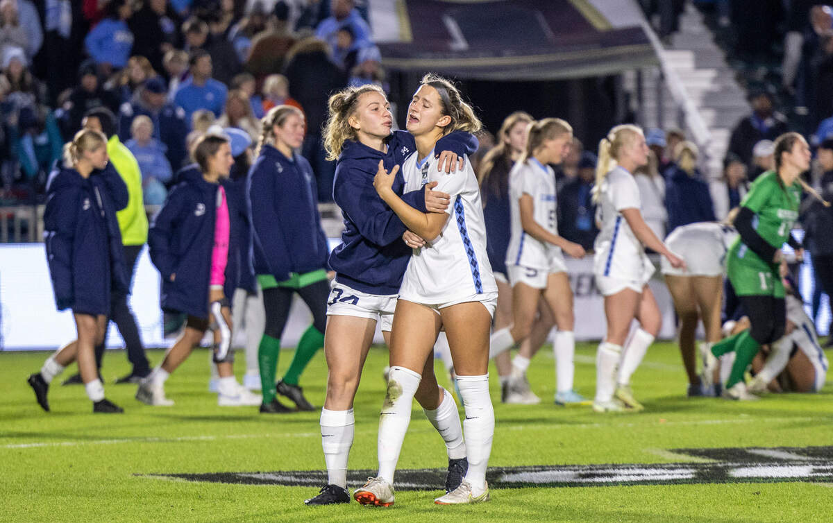 Dejected UNC players comfort each other after losing 3-2 in overtime against UCLA during the NCAA Division I Championship at WakeMed Soccer Park in Cary Monday, Dec. 5, 2022.