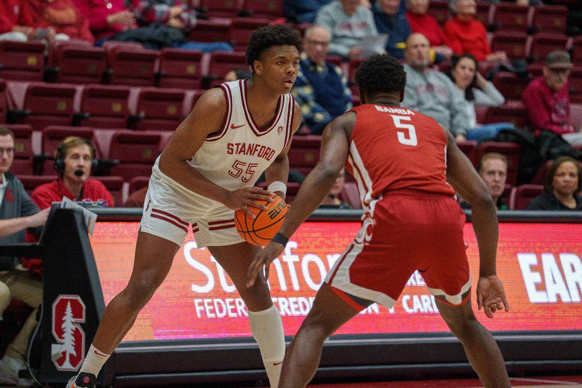 Stanford Cardinal forward Harrison Ingram (55) looks to pass the ball against Washington State Cougars guard TJ Bamba (5) during the first half at Maples Pavilion.