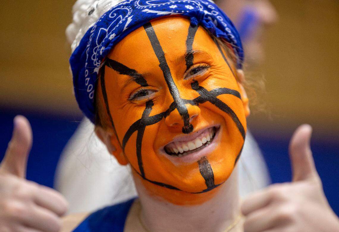 Duke student Carly Hester, shows off her face paint as he arrives for the Blue Devils’ game against North Carolina on Saturday, February 1, 2025 at Cameron Indoor Stadium in Durham, N.C.