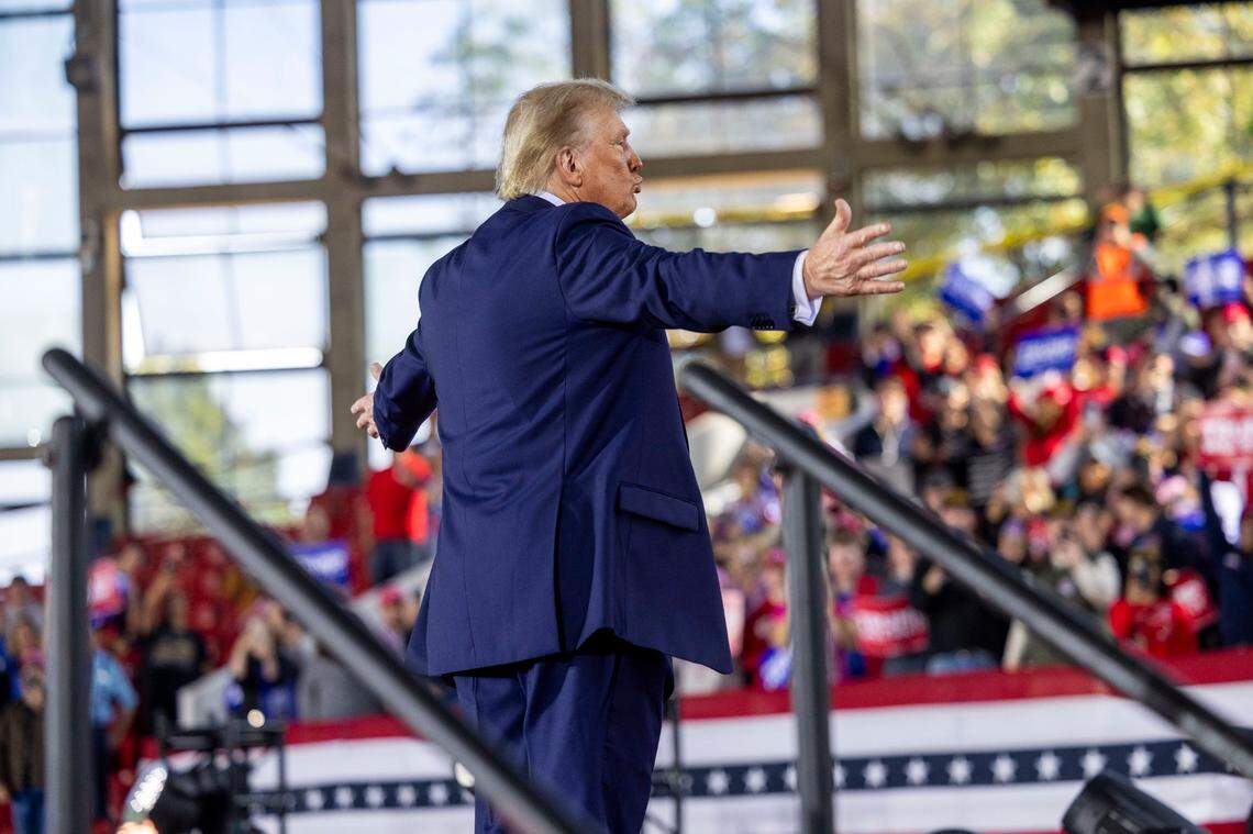 Republican presidential nominee and former President Donald Trump leaves the stage following a rally at Dorton Arena in Raleigh on Monday, Nov. 4, 2024, one day before Election Day.