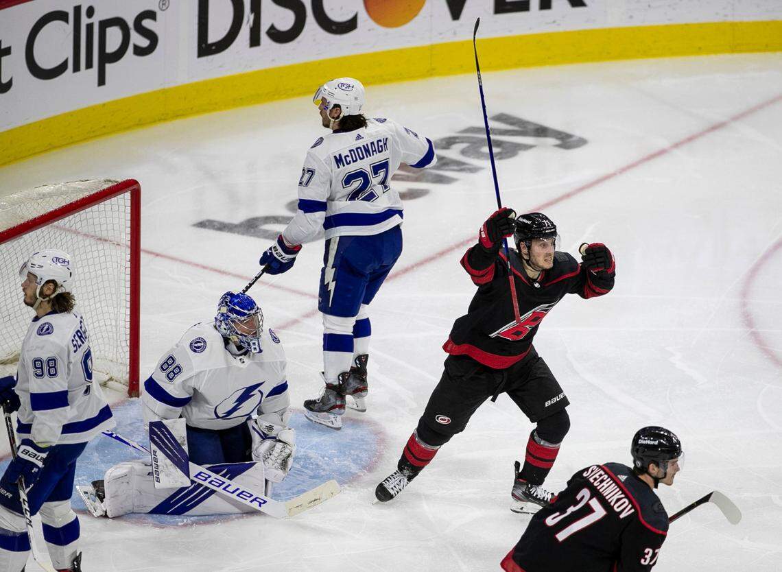 Carolina Hurricanes’ Jesper Fast (71) reacts after a goal by teammate Jake Bean (24) to tie Tampa Bay 1-1 in the third period of game one of their second round Stanley Cup series on Sunday, May 30, 2021 at PNC Arena in Raleigh, N.C.