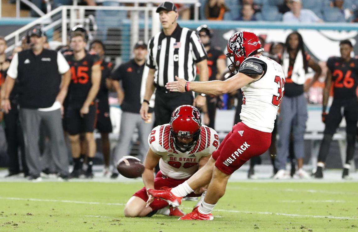 N.C. State’s Christopher Dunn (32) kicks a 33-yard field goal during the first half of N.C. State’s game against Miami at Hard Rock Stadium in Miami Gardens, Fla. Saturday, Oct. 23, 2021. With the field goal Dunn became the all-time leading scorer in Wolfpack history.
