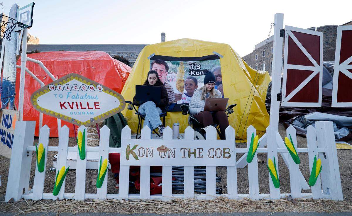 Duke seniors Emma Fleischman, left and Kseniia Kholina work in Krzyzewskiville at Duke University in Durham, N.C., Tuesday, Jan. 28, 2025. The is the 39th year of tenting for students who want to attend the game against UNC. One hundred thirty tents were set up on Jan. 12, with 12 students per tent. It is the only way undergraduates can go to the game.