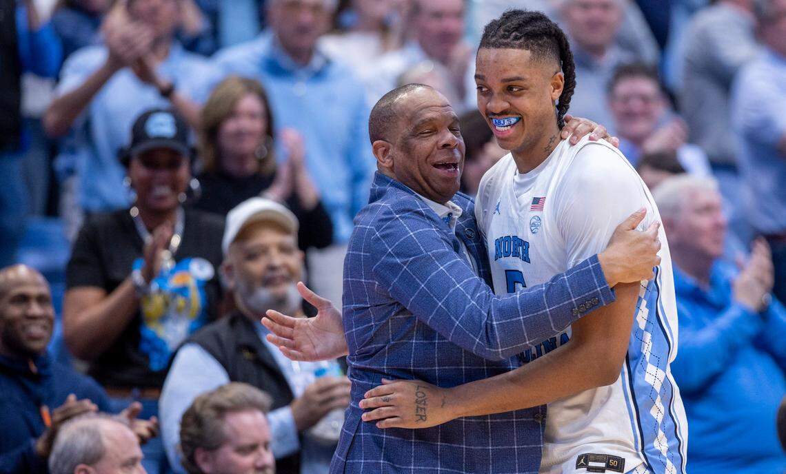 North Carolina’s Armando Bacot (5) gets a hug from coach Hubert Davis as he leaves the game with 14 points in the Tar Heels’ 84-51 victory over Noter Dame, and Bacot’s final home game on Tuesday, March 5, 2023 at the Smith Center in Chapel Hill, N.C.