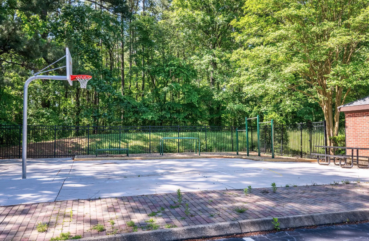 The Pines apartment complex has half-court basketball, a garden and dog park.