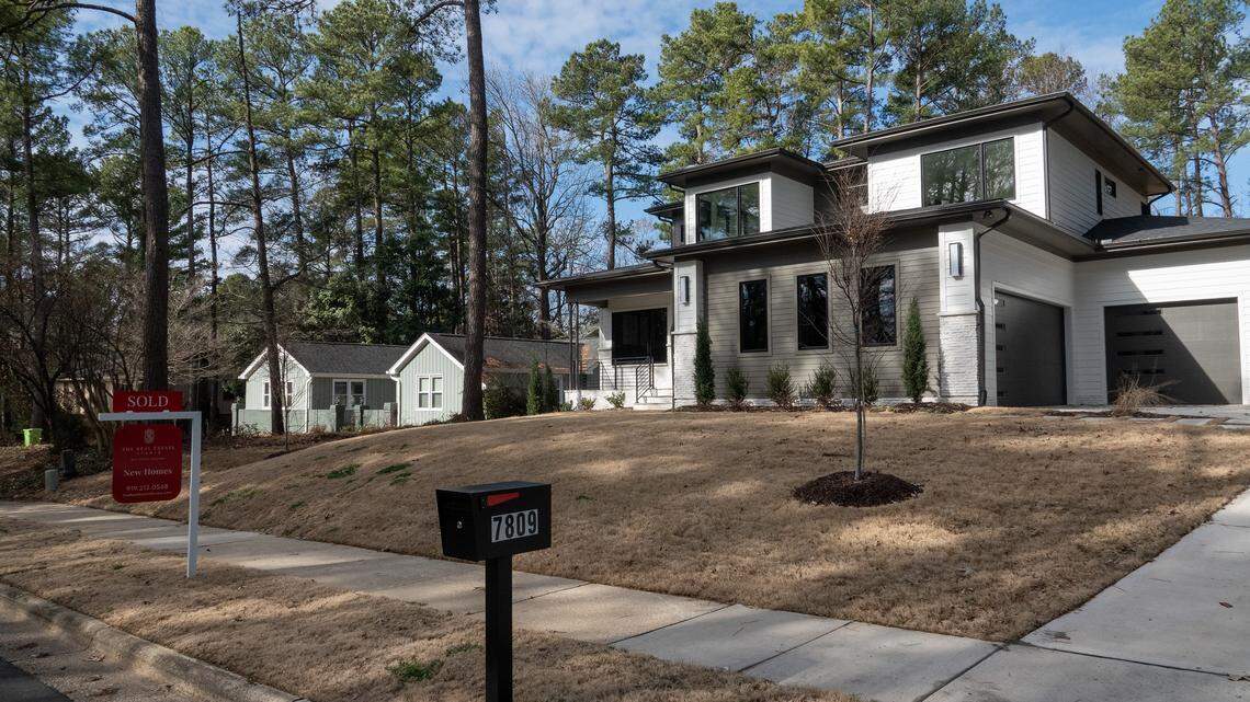 A newly built home at 7509 Haymarket Lane in Raleigh, NC looms above its neighbor on either side. The home, listed for $1.75 million, was recently sold.