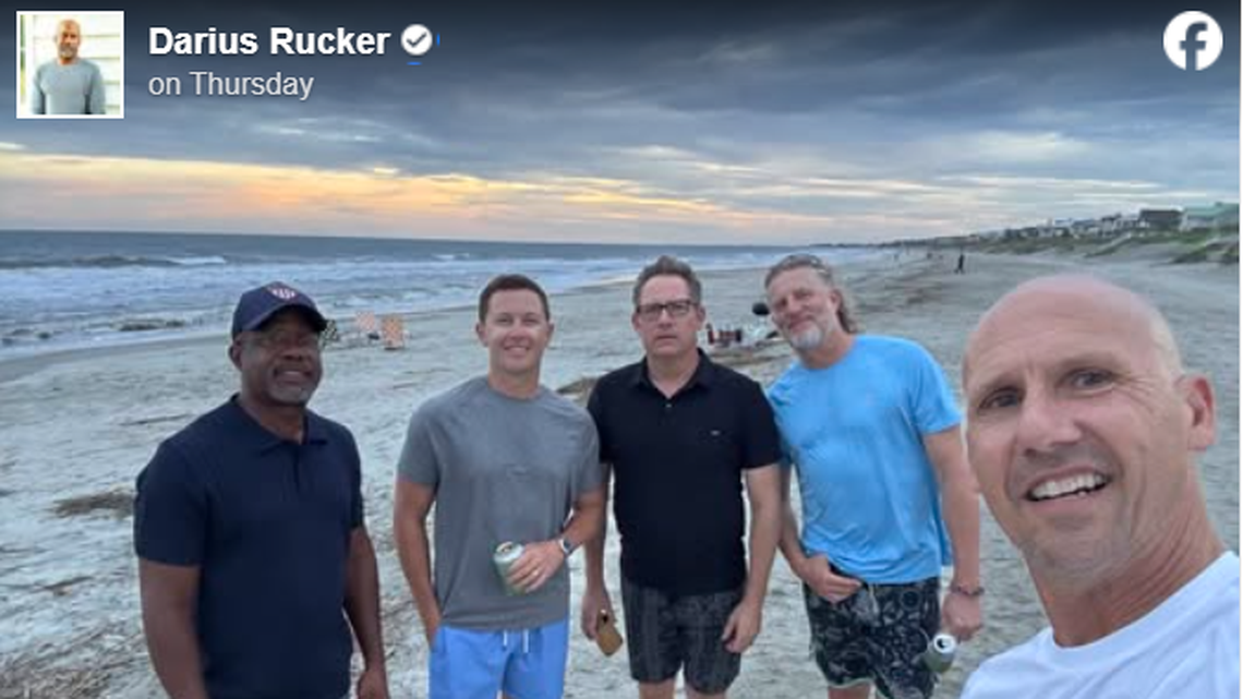 A screenshot from Darius Rucker’s Facebook page of a photo with his Hootie & the Blowfish bandmates and Scotty McCreery.