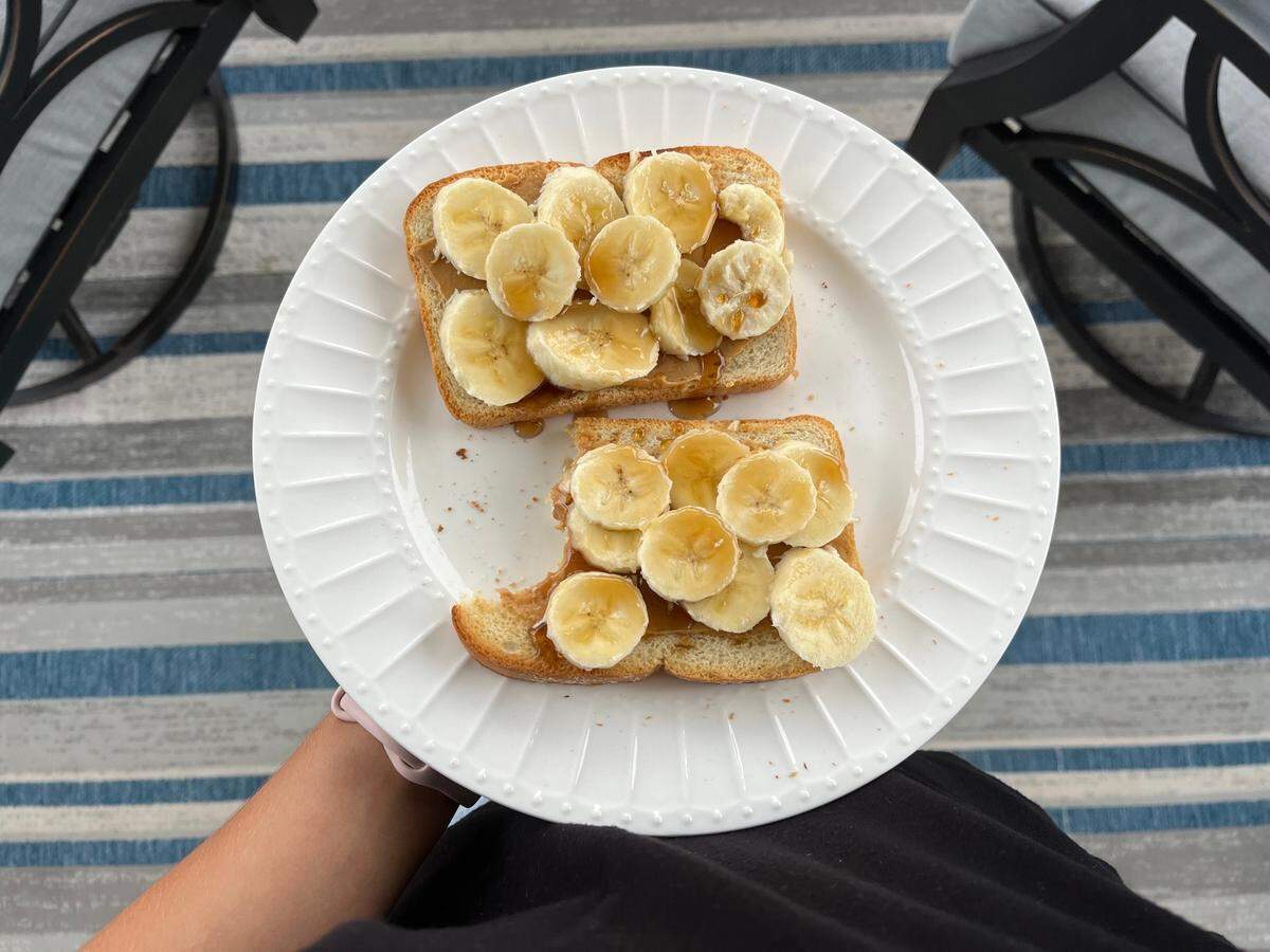 Purple honey drizzled on peanut butter banana toast on Oct. 26, 2022.