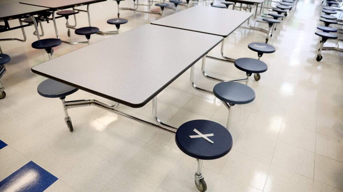 Wake Forest Middle School has placed stickers in the cafeteria where students can sit in preparation for reopening on Monday, Nov. 9, 2020.