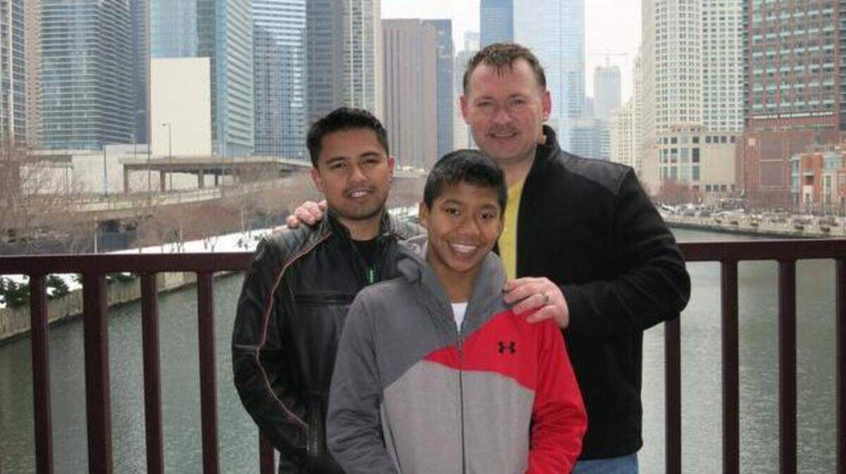 Jerry Windle, right, pictured with his partner Andres Rodriguez and adoptive son Jordan Windle, in 2014. Windle resigned Monday from the Morrisville Town Council.