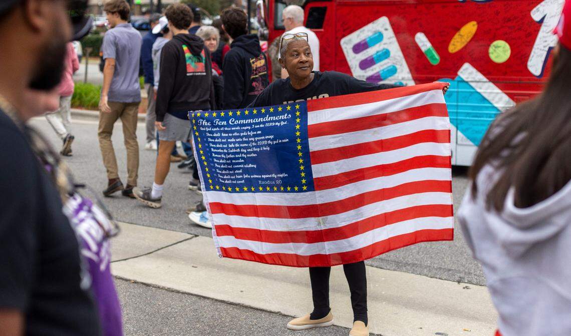 Inez Dudley of Greenville, N.C., offers spiritual encouragement to those waiting in line to enter a rally for former President Donald Trump on Wednesday, October 30, 2024 at the Rocky Mount Event Center in Rocky Mount, N.C.