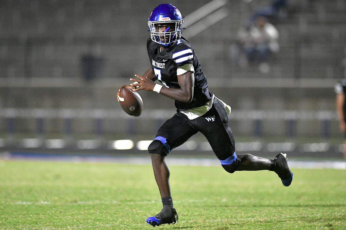 Wake Forest quarterback Kavon Simmons (7) runs and looks to pass downfield against Clayton during the second half of their game. The Wake Forest Cougars and the Clayton Comet met in a non-conference football game in Wake Forest, N.C. on August 23, 2024.