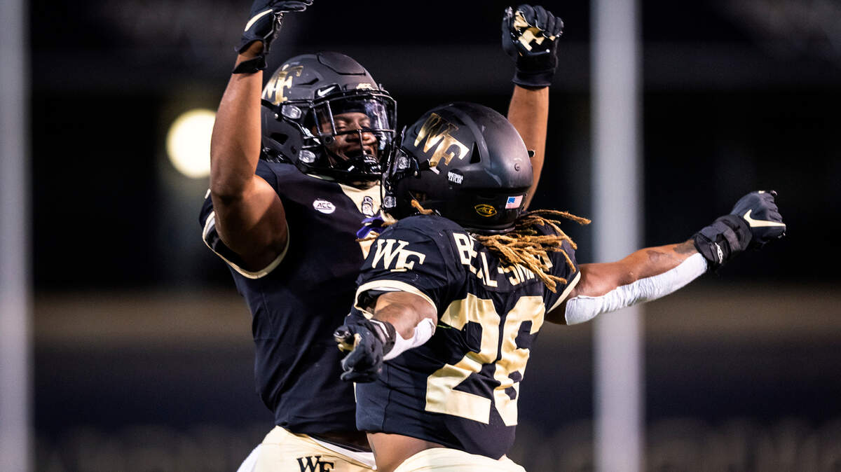 Wake Forest running back Christian Beal-Smith (26) his touchdown against Campbell with running back Kenneth Walker III during an NCAA college football game Friday, Oct. 2, 2020, in Winston-Salem, N.C. (Andrew Dye/The Winston-Salem Journal via AP)