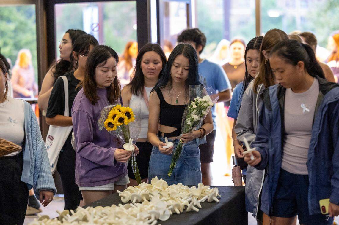 UNC-Chapel Hill students gather for a candle light vigil Friday, Aug 30, 2023 at the Dean Smith Center in honor of professor Zijie Yan who was shot and killed on campus on Monday.