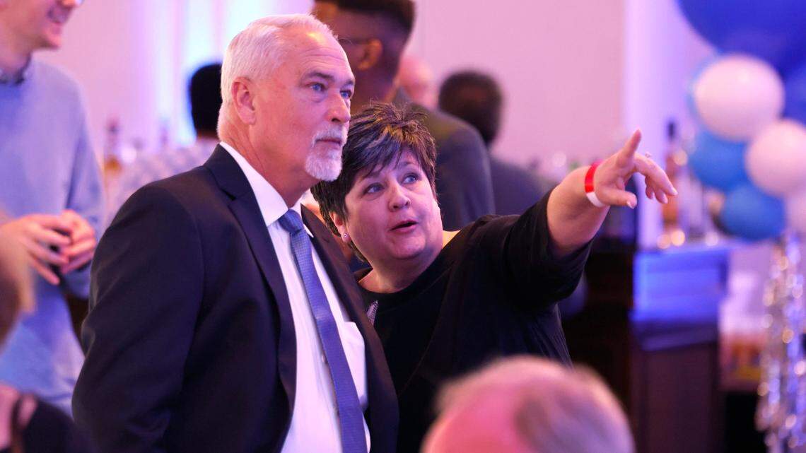 Christi Hooper and her fiancé Johnny Phillips watch as returns come in during a North Carolina Democratic Party election night event at the Marriott City Center in Raleigh, N.C., Tuesday, Nov. 5, 2024.