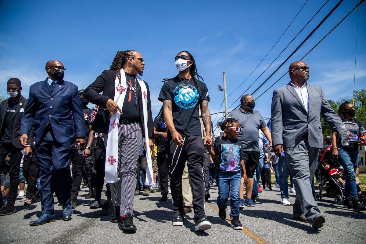Hundreds of demonstrators led by Andrew Brown Jr.Õs family and Rev. Greg Drumwright, march Sunday, May 2, 2021 to the site where Brown was shot and killed by Pasquotank County Sheriff deputies. BrownÕs funeral will be held Monday.