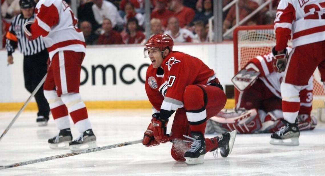 Carolina Hurricanes (10) Ron Francis turns to celebrate his game winning goal in overtime on Detroit goalie (39) Dominik Hasek to give the Hurricanes a 3-2 victory on May 4, 2002 in the first game of the Stanley Cup Championship series at Joe Louis Arena. Robert Willett 2002 NEWS & OBSERVER FILE PHOTO
