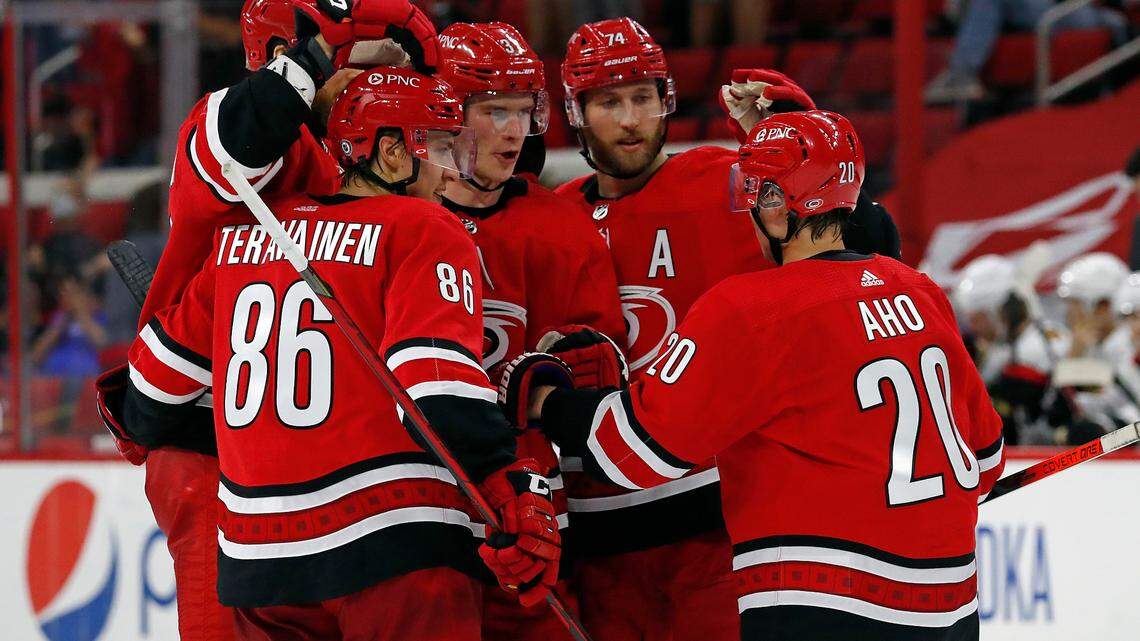 Carolina Hurricanes’ Andrei Svechnikov, center, is congratulated on his goal by teammates during the second period of an NHL hockey game against the Chicago Blackhawks in Raleigh, N.C., Tuesday, May 4, 2021. (AP Photo/Karl B DeBlaker)