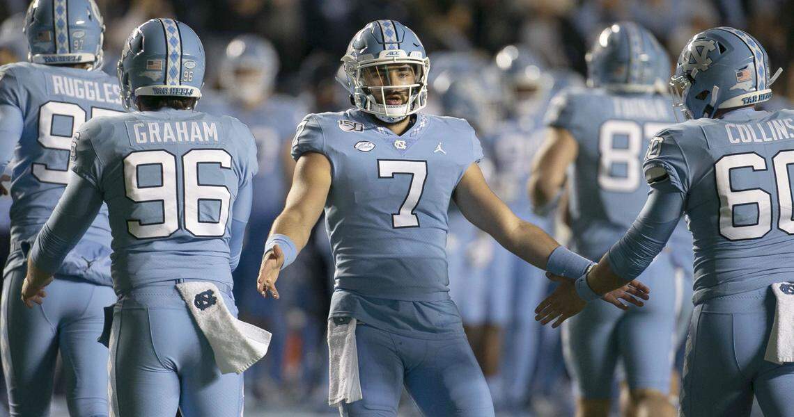 North Carolina quarterback Sam Howell (7) congratulates teammates after the Tar Heels scored to take a 17-10 lead over Virginia in the second quarter n Saturday, November 2, 2019 at Kenan Stadium in Chapel Hill, N.C.