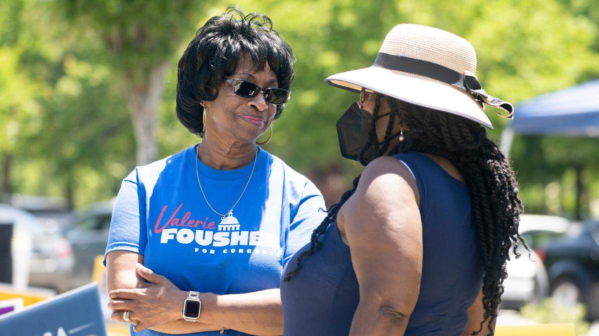 Congress candidate Valerie Foushee talks with Brenda Ford Harding, a previous employee of Foushee, outside the polling site at South Regional Durham County Library in Durham, N.C. on Tuesday, May 17, 2022.