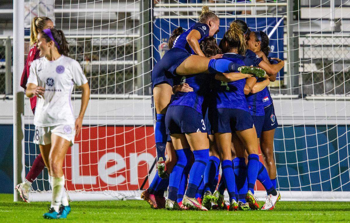 North Carolina Courage players celebrate a first half goal against Racing Louisville Wednesday, Oct. 6, 2021 at WakeMed Soccer Park in Cary. The NC Courage won 3-1.