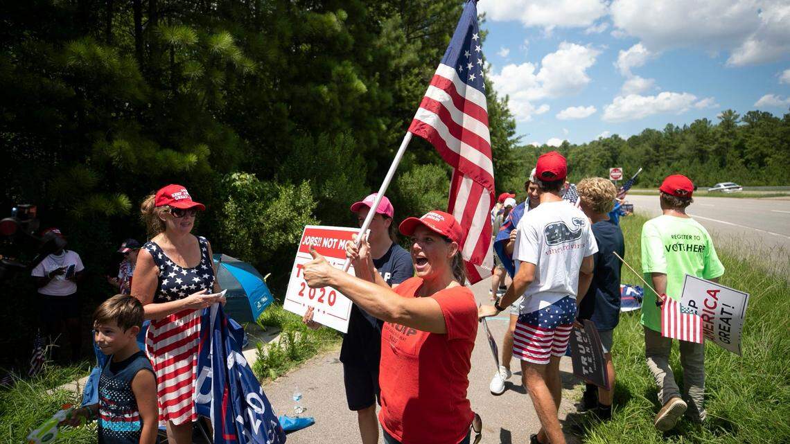 Trump supporter Michele Morrow of Cary, N.C. was part of nearly 200 supporters of President Donald Trump that lined Davis Drive awaiting the arrival of the president on Monday, July 27, 2020 in Morrisville, N.C. Trump is scheduled to make a visit to Fujifilm Diosynth where they are are manufacturing a COVID-19 vaccine for Novavax.