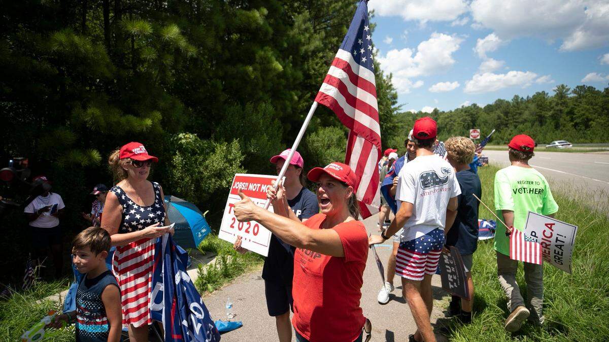 In this July 27, 2020 photo, Michele Morrow of Cary, N.C., center, waits with others for President Donald Trump to show up at Morrisville, N.C. event. Morrow is now the Republican nominee for N.C. superintendent of schools. A recent CNN investigation revealed that in 2020 she expressed support on social media for the televised execution of former President Barack Obama and suggested killing then President-elect Joe Biden.