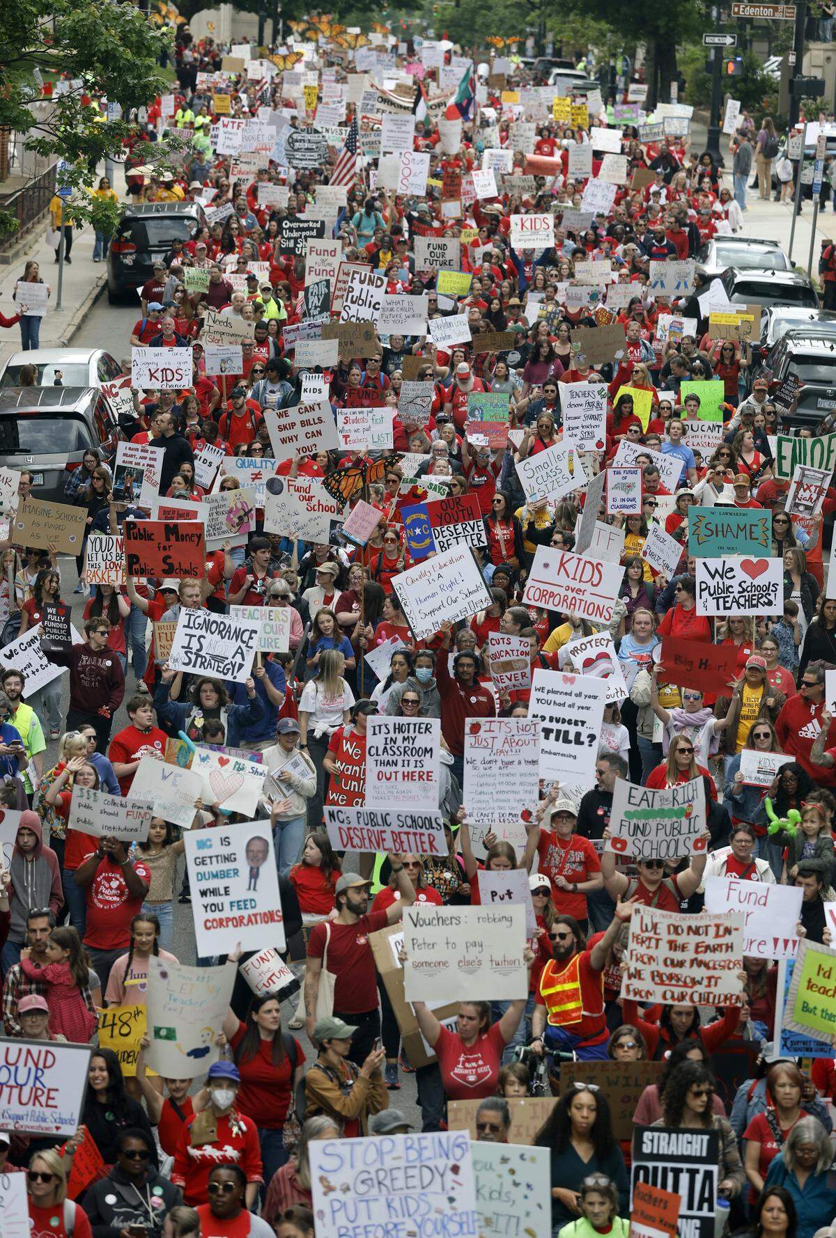 Thousands march down N. Salisbury St. in downtown Raleigh during a rally and march to protest for more school funding Friday, May 1, 2026. The North Carolina Association of Educators has mobilized teachers from across the state to march on the Legislative Building to demand higher pay, more school funding and higher taxes on corporations. 