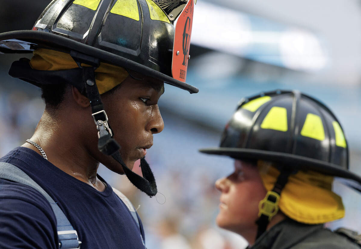 Sweat beads on the face of a participant while climbing the stairs of Kenan Memorial Stadium during an event in Chapel Hill, N.C. on Thursday, Sept. 11, 2025, to honor those who lost their lives during the attacks of Sept. 11, 2001.