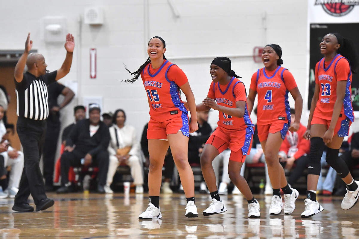 Princess Anne’s Jizelle James (15) reacts with teammates after being fouled after making a three point shot in the second half. The Grace Christian Crusaders and the Princess Anne (VA ) Cavaliers met in the Wonderland final of the John Wall Holiday Invitational in Raleigh, N.C. on December 30, 2024.