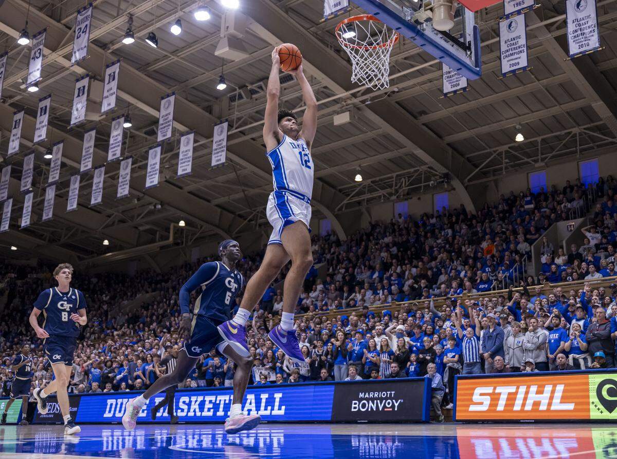 Duke forward Cameron Boozer (12) soars to the rim for a dunk in the first half against Georgia Tech on Wednesday, December 31, 2025 at Cameron Indoor Stadium in Durham, N.C.