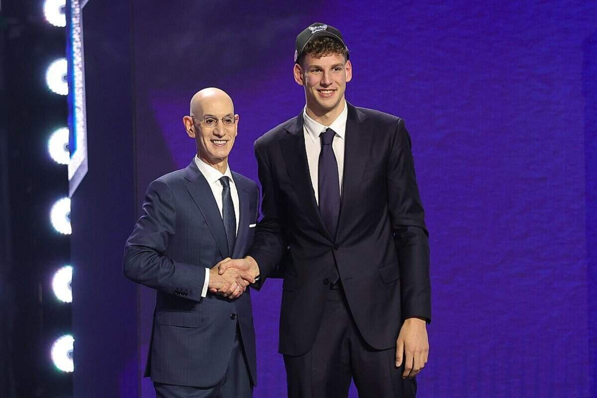 NEW YORK, NEW YORK - JUNE 23:  NBA commissioner Adam Silver shakes hands with Hannes Steinbach after he is drafted fourteenth overall by the Charlotte Hornets during Round One of the 2026 NBA Draft at Barclays Center on June 23, 2026 in New York City.  (Photo by Arturo Holmes/Getty Images)