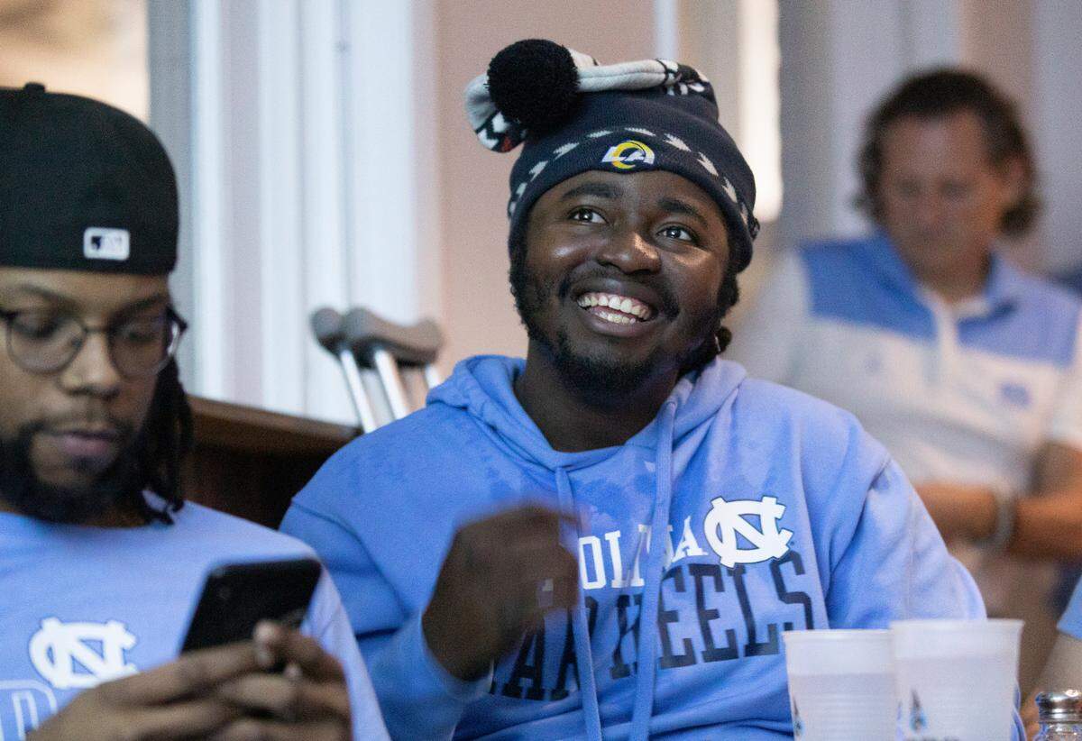Treshaun Crumpler smiles while watching the UNC Tar Heels in Top of the Hill in Chapel Hill, N.C. as they compete against Kansas in the NCAA Championship game on Monday, April 4, 2022.