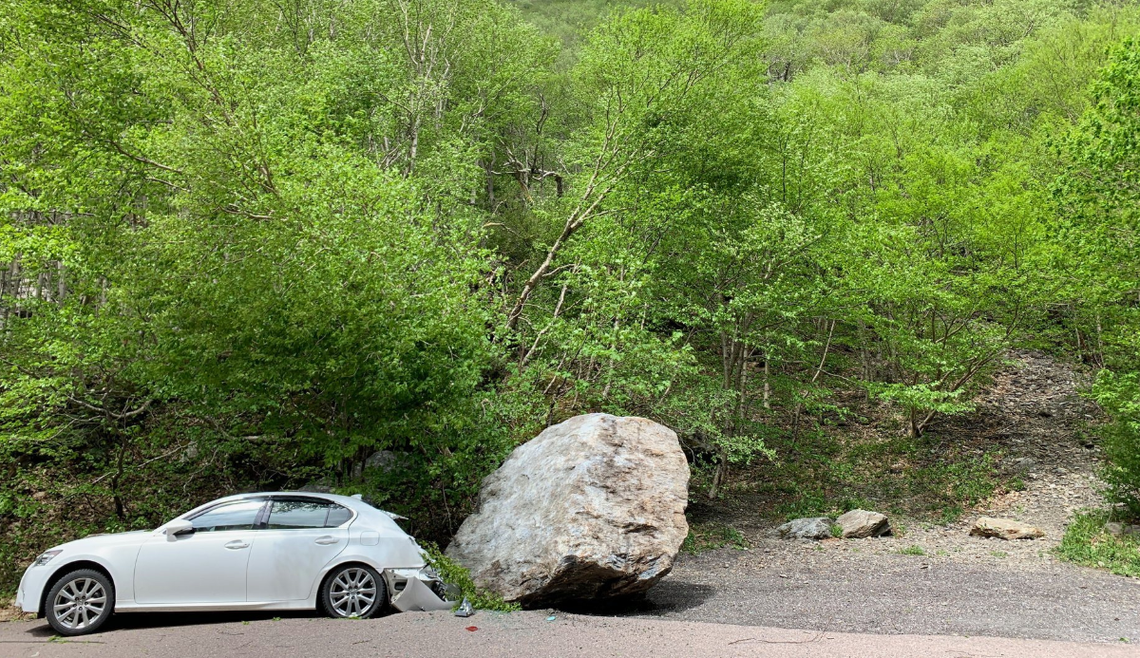A rock slide Sunday at Smugglers’ Notch in Vermont nearly crushed this car after the driver got out.
