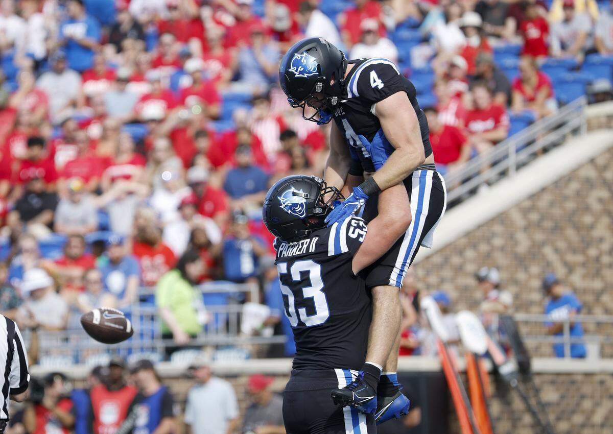 Duke’s Brian Parker II and Anderson Castle celebrate following a touchdown during the first half of the Blue Devils’ game against N.C. State on Saturday, Sept. 20, 2025, at Wallace Wade Stadium in Durham, N.C.