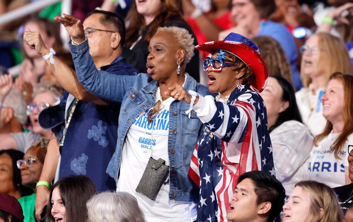 Supporters cheer on Mo Green, who is running for NC Superintendent of Public Instruction, during a rally for Vice President and democratic nominee for president Kamala Harris at the Greensboro Coliseum in Greensboro, N.C., Thursday, Sept. 12, 2024.