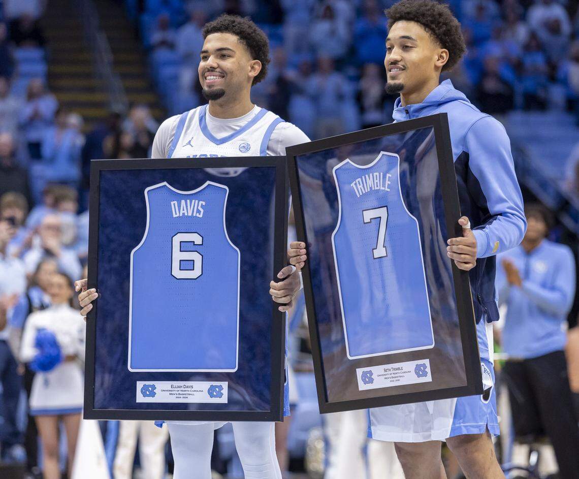 North Carolina guards Seth Trimble (7) and Elijah Davis (6) are honored on ‘Senior Night’ prior to playing their final home game against Clemson on Tuesday, March 3, 2026 at the Smith Center in Chapel Hill, N.C.