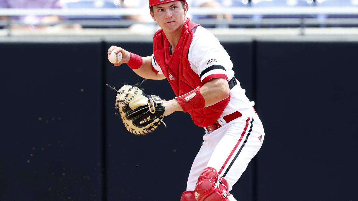 N.C. State’s Patrick Bailey (5) gets ready to throw to first base to force out Campbell’s AJ Hrica during N.C. State’s game against Campbell in the Greenville Regional at Clark-LeClair Stadium in Greenville, N.C., Friday, May 31, 2019.