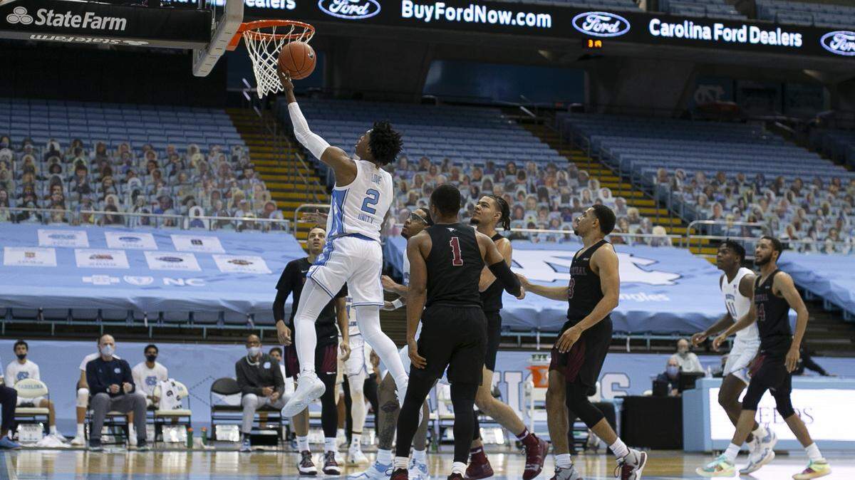 North Carolina’s Caleb Love (2) drives to the basket for two of his 12 points in the second half against N.C. Central University on Dec. 12, 2020, at the Smith Center in Chapel Hill.