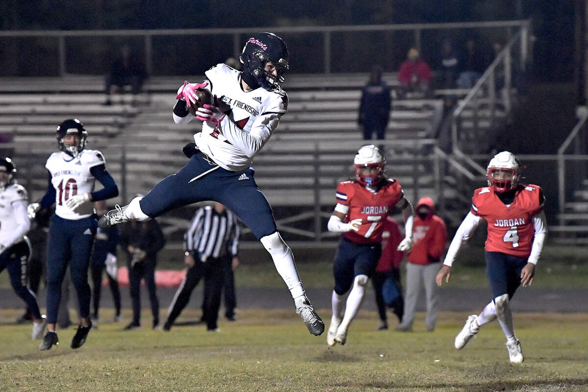 Apex Friendship’s David Lozada (11) makes the catch and eventually scores the touchdown during the first half. The Apex Friendship Patriots and the Durham Jordan Falcons met in the second round of the NCHSAA 4A playoffs in Durham, N.C. on November 22, 2024.