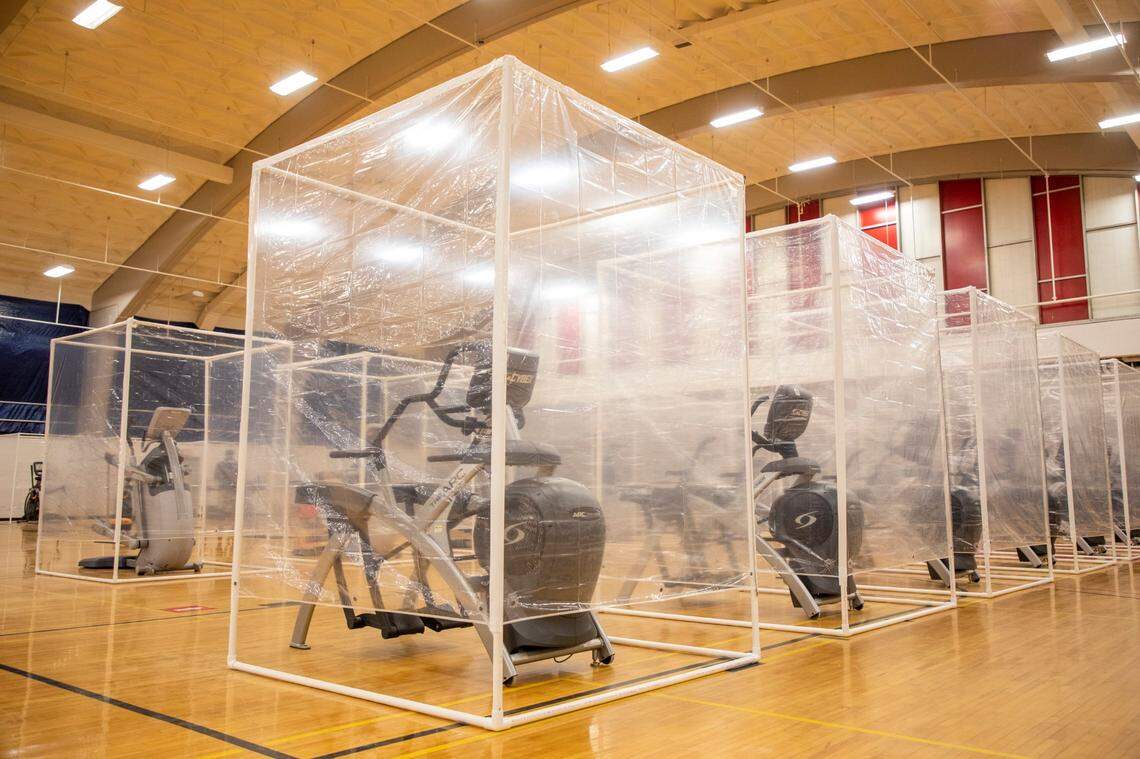 Made of plastic pipe and shower curtains, barriers will separate people while they are breathing heavily on cardio equipment in the Carmichael Gymnasium at N.C. State University, to prevent the spread of COVID-19, when it can open in compliance with Gov. Roy Cooper's orders, for students who will be returning to campus for the fall semester, on Wednesday, July 22, 2020, in Raleigh, N.C.